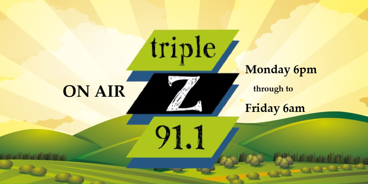 The logo of 5 Triple Z which has a graphic of green hills in the background with sunrays coming up behind it.